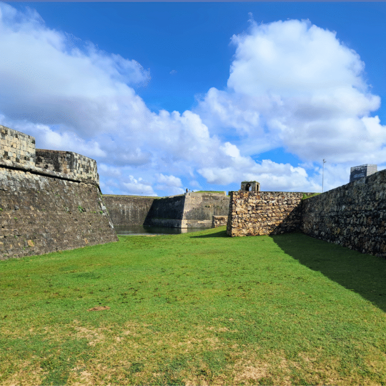 Panoramic shot of Jaffna Fort surrounded by lush greenery.
