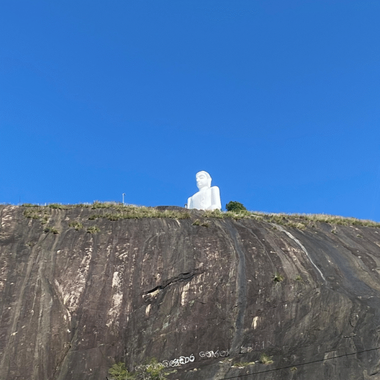 The towering white Buddha statue at Athugala Viharaya overlooking Kurunegala town.