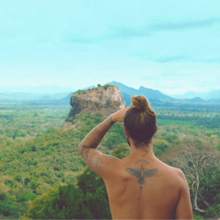 Tourist standing on top of Pidurangala Rock in Sri Lanka