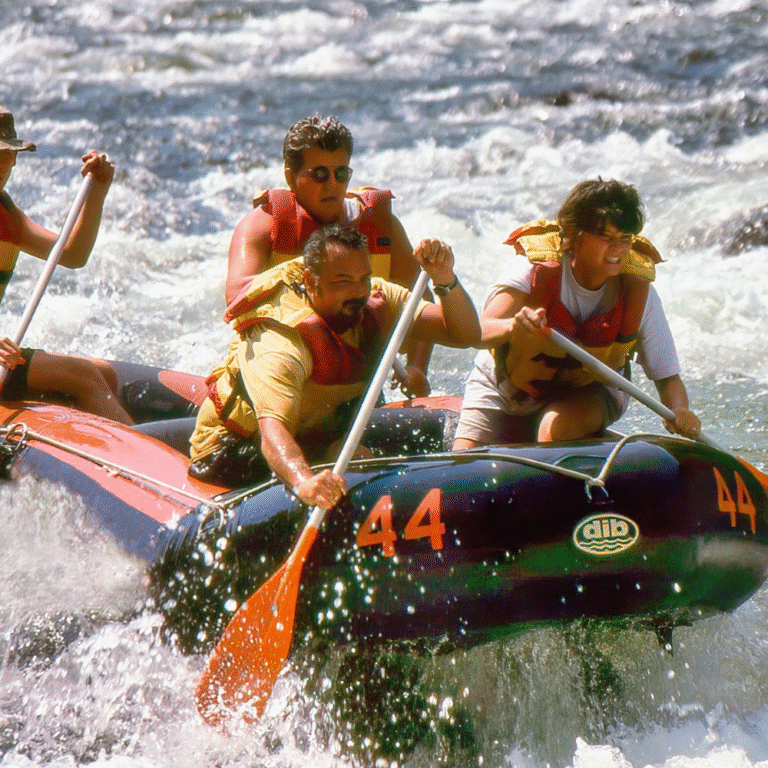 Rafting team paddling through waves in Kitulgala rainforest