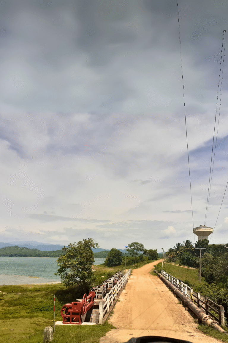 Sunset over the calm Muruthawela Reservoir in Sri Lanka