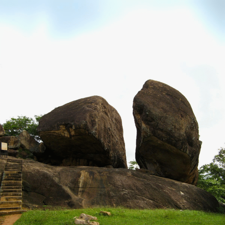Historical meditation shelters carved into rocks at Vessagiriya