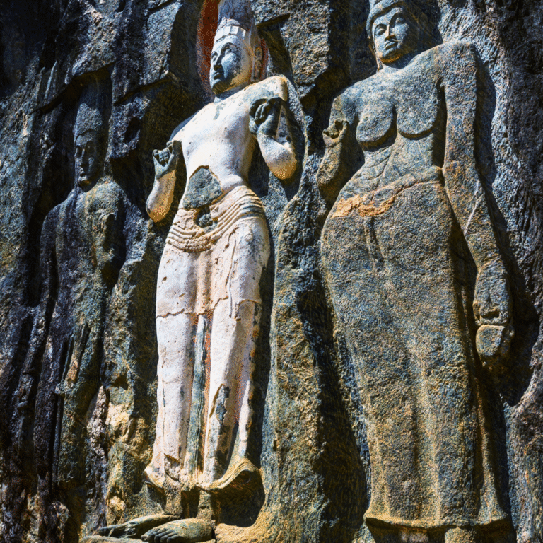 Ancient Buddha statue carved into the rock at Buduruwagala