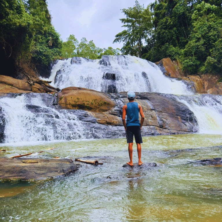 Tourists enjoying the natural beauty of Sathmala Ella Waterfall