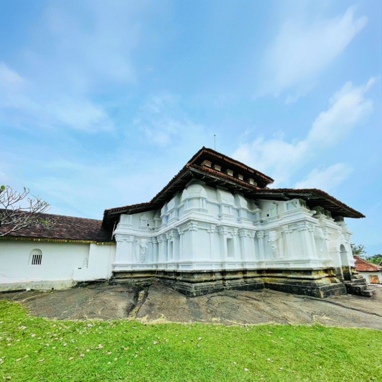 Scenic view of Lankathilaka Viharaya surrounded by lush greenery