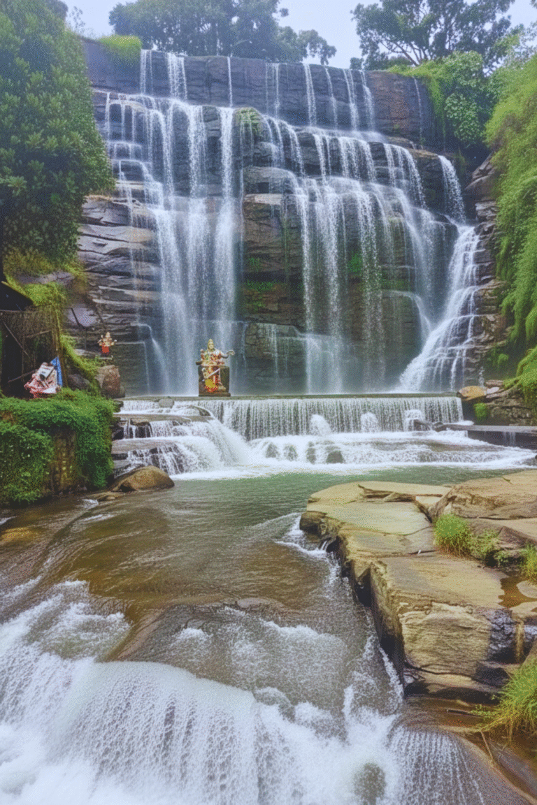 Dunsinane Falls Pundaluoya surrounded by lush greenery in Sri Lanka