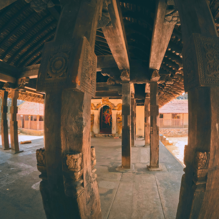 Detailed carvings on wooden pillars of Embekka Temple