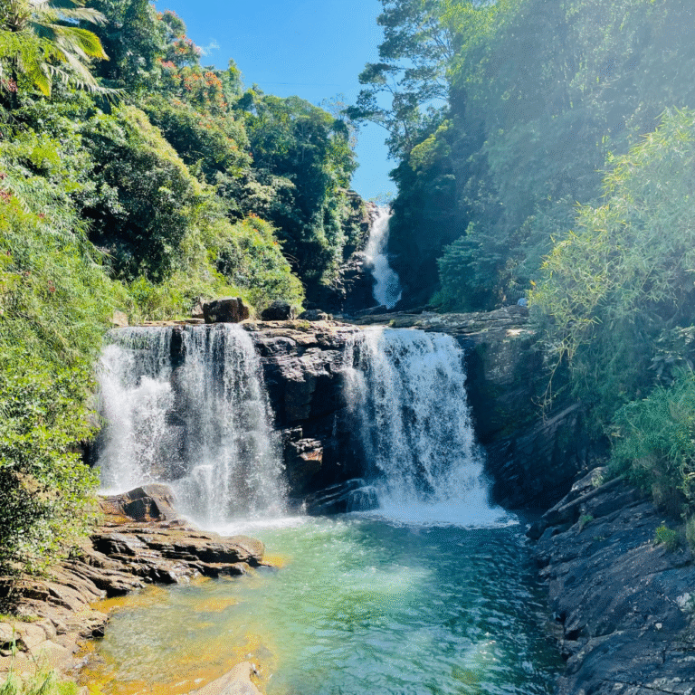 Scenic view of Kadiyanlena Falls cascading through rocks