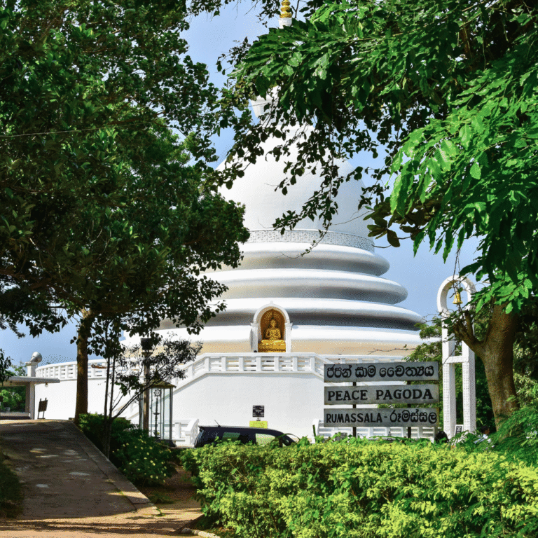 Rumassala Japanese Peace Pagoda surrounded by lush greenery