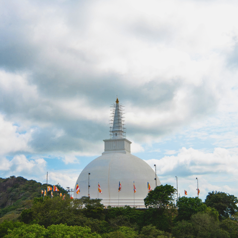 White stupa surrounded by greenery at Mihintale