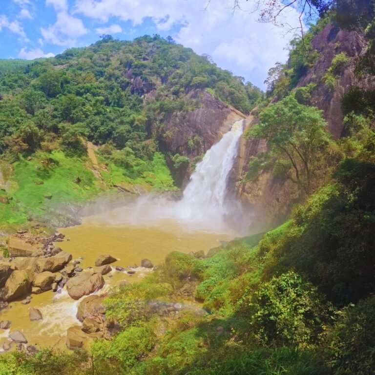 Dunhinda Falls with clear flowing water and natural landscape