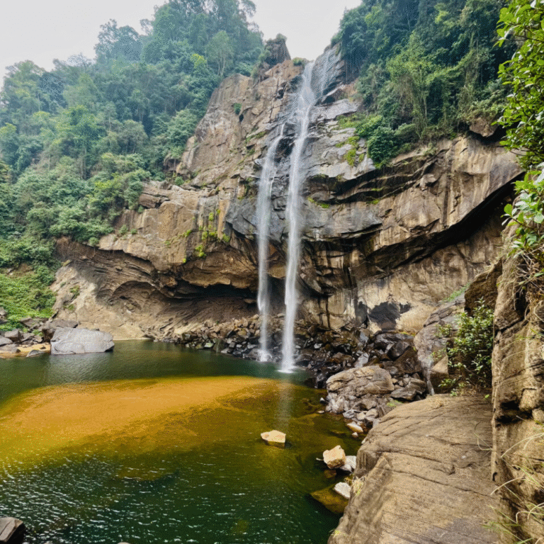 Breathtaking view of Aberdeen Waterfall cascading through lush greenery