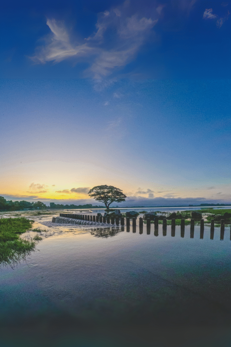 Sunset reflecting on the calm surface of Chandrika Wewa