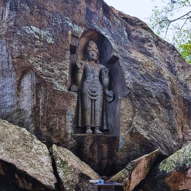 Buddha statue carved into the rock at Kushtarajagala site
