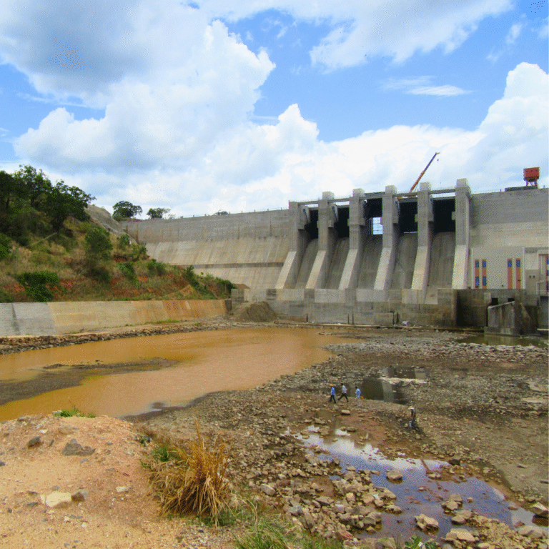 Moragahakanda Dam reservoir surrounded by lush greenery