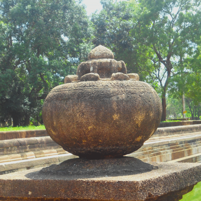 Historic Kuttam Pokuna stone pools surrounded by greenery