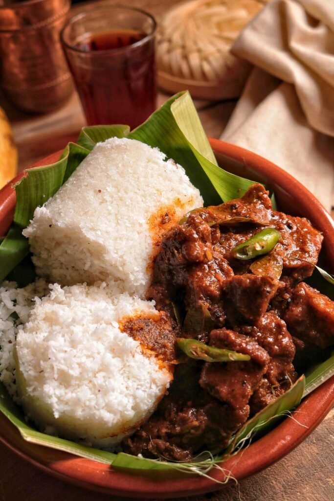 Pittu with spicy coconut sambol and fish curry