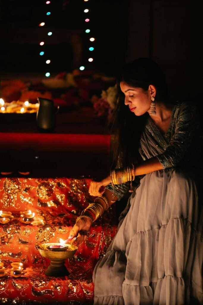 Hindu devotees lighting clay lamps during Diwali in Colombo