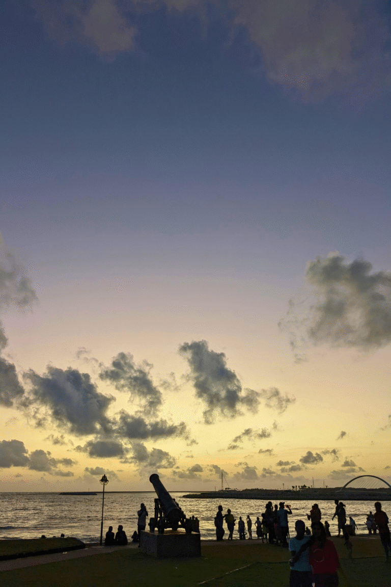 golden sunset reflecting over galle face green