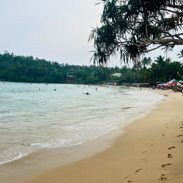 Golden sunset over Hiriketiya Beach in Sri Lanka