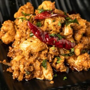 Traditional Sri Lankan chicken curry with rice meal