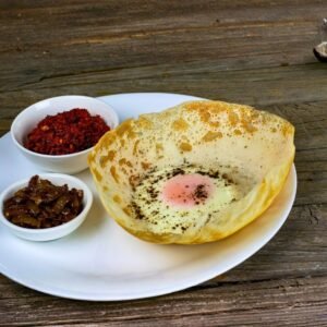 Authentic Sri Lankan breakfast with egg hoppers and lunu miris