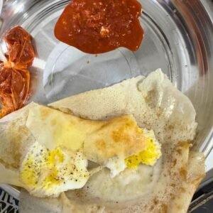 Delicious Sri Lankan hopper with spicy sambol on the side