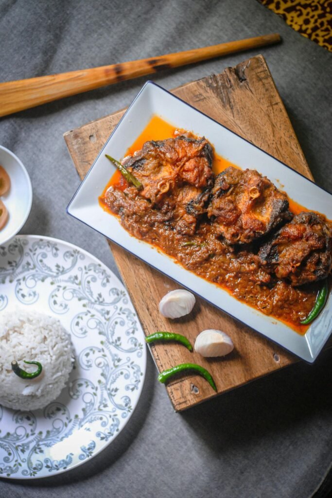 Sri Lankan style fish curry garnished with curry leaves