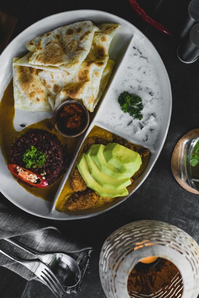 Parata served hot with spicy curry in Sri Lanka