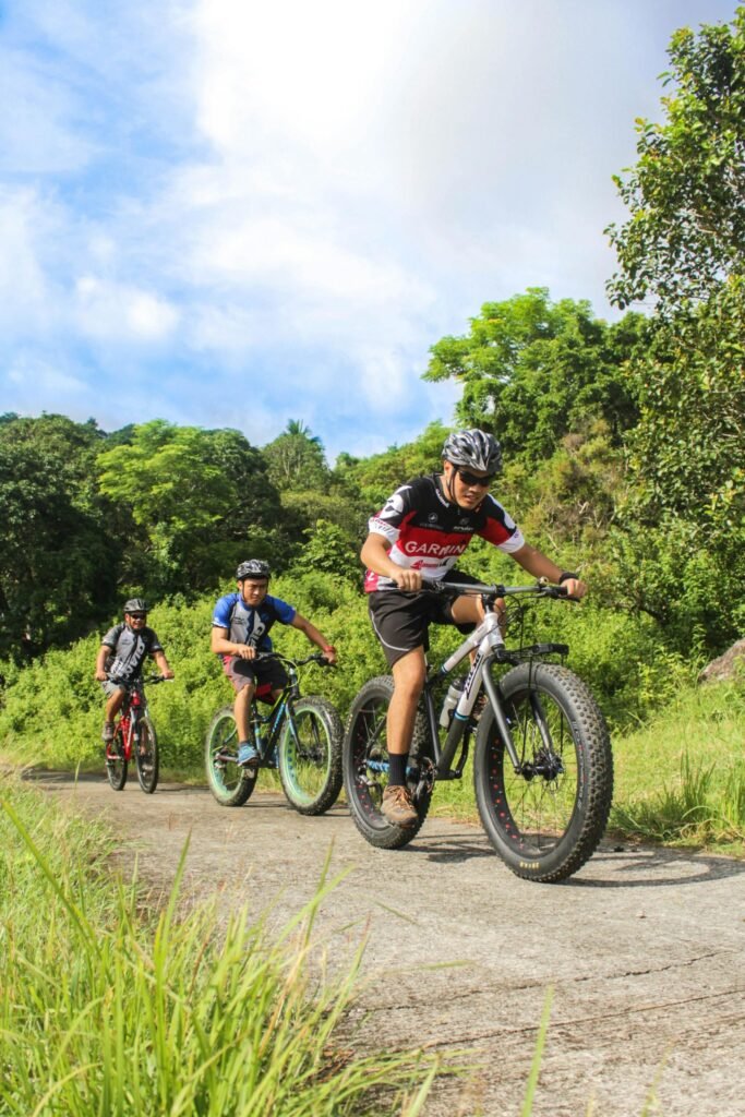 Cyclists riding along a scenic coastal road in Sri Lanka