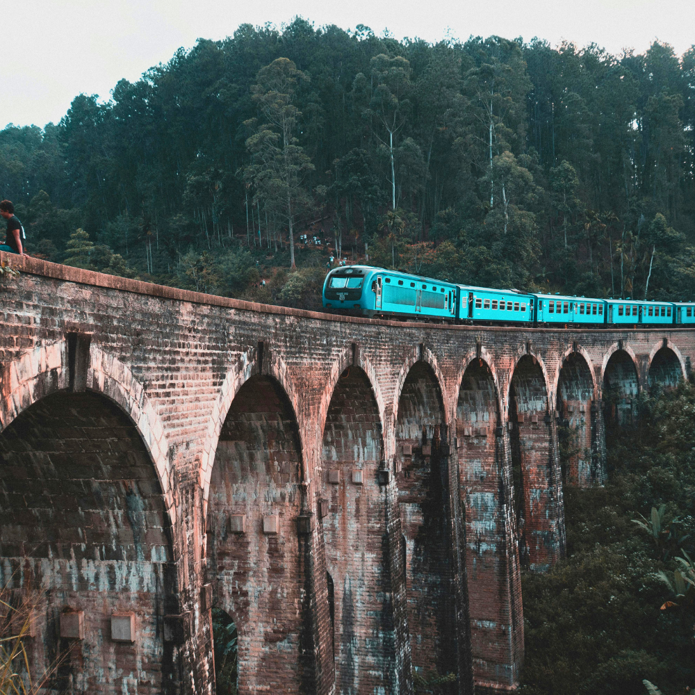 Train crossing Nine Arches Bridge in Sri Lanka