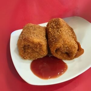 traditional spicy fish rolls served with sauce
