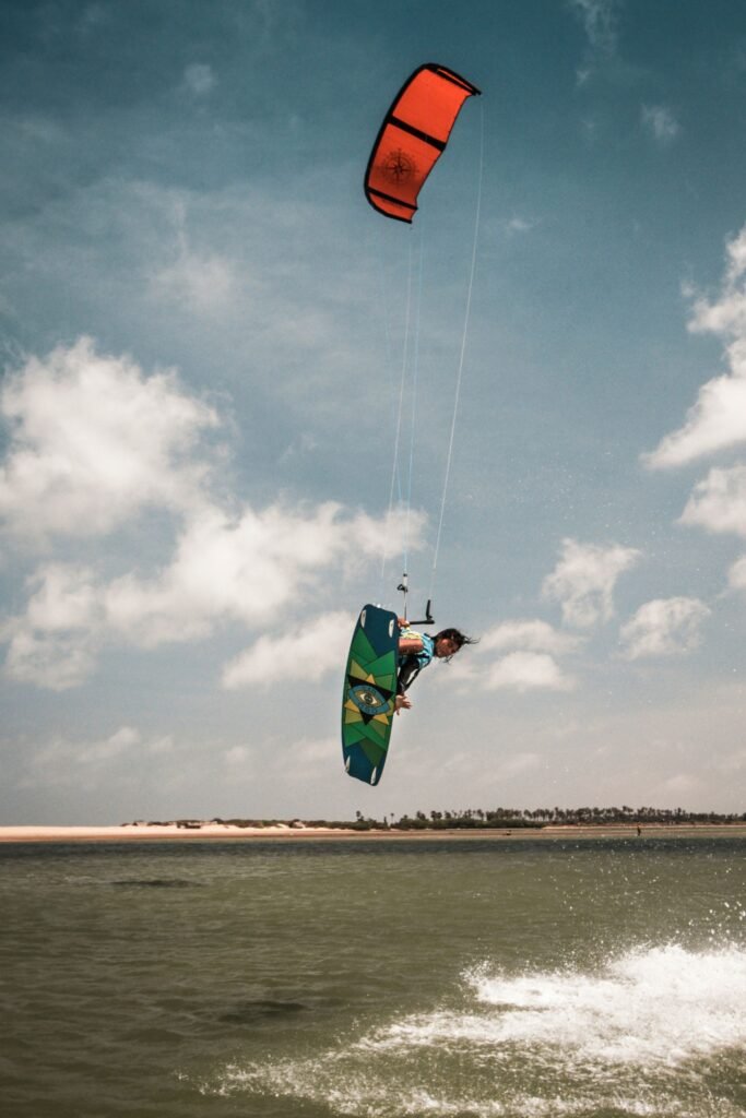 Action shot of kite surfing over ocean waves