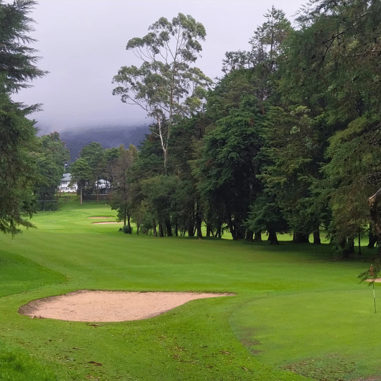 Nuwara Eliya Golf Club surrounded by misty hills