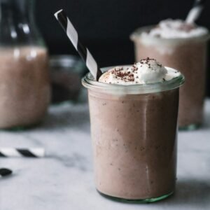 iced milkshake beverage with chocolate drizzle