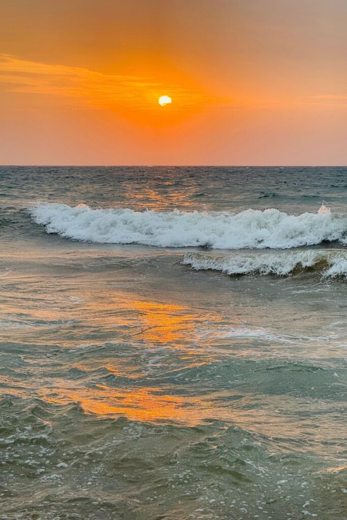 Tourists enjoying a beautiful sunset by the Sri Lankan coast