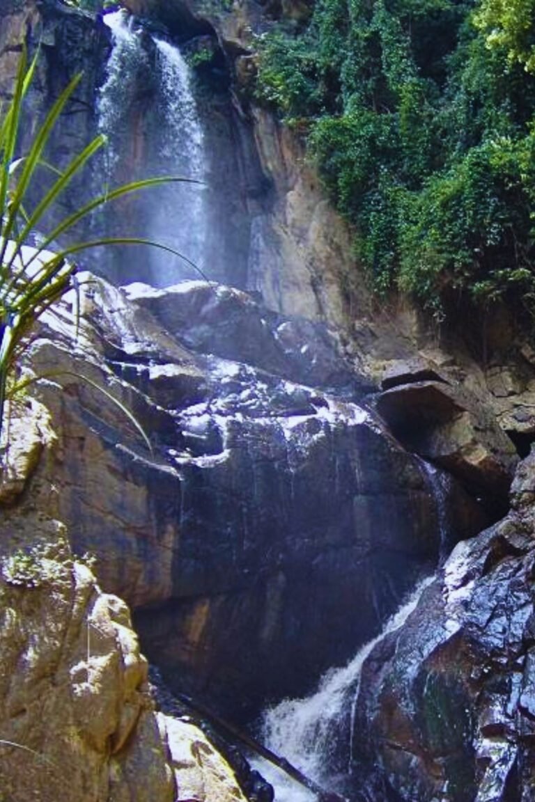 Scenic view of the Small Rawana Falls flowing through rocky landscape