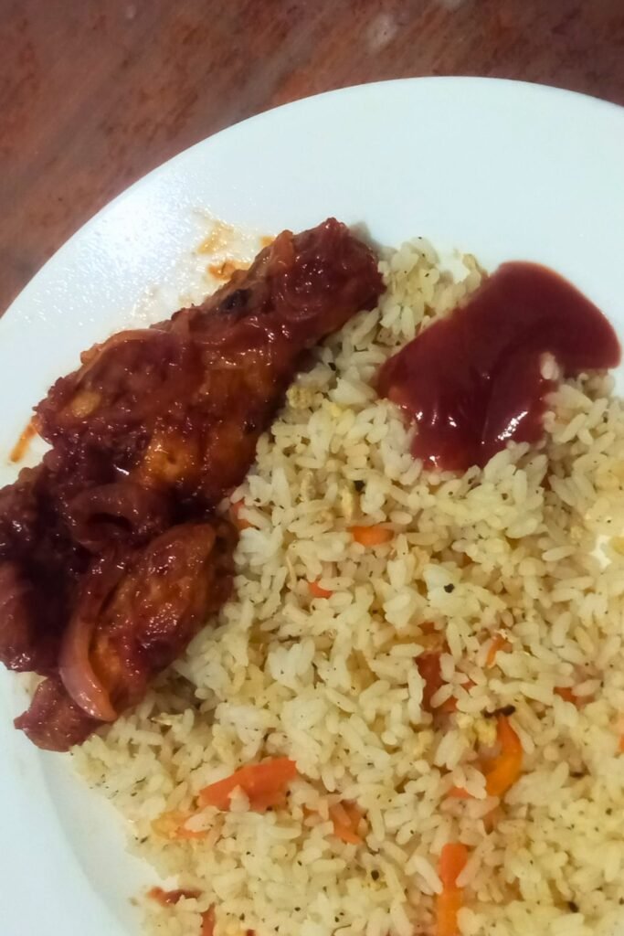 spicy devil chicken served with rice in Sri Lanka