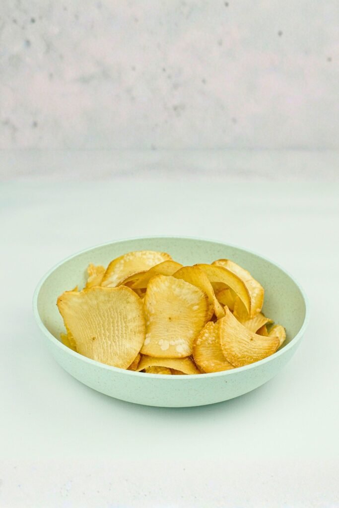 Freshly fried cassava chips on a plate in Sri Lanka