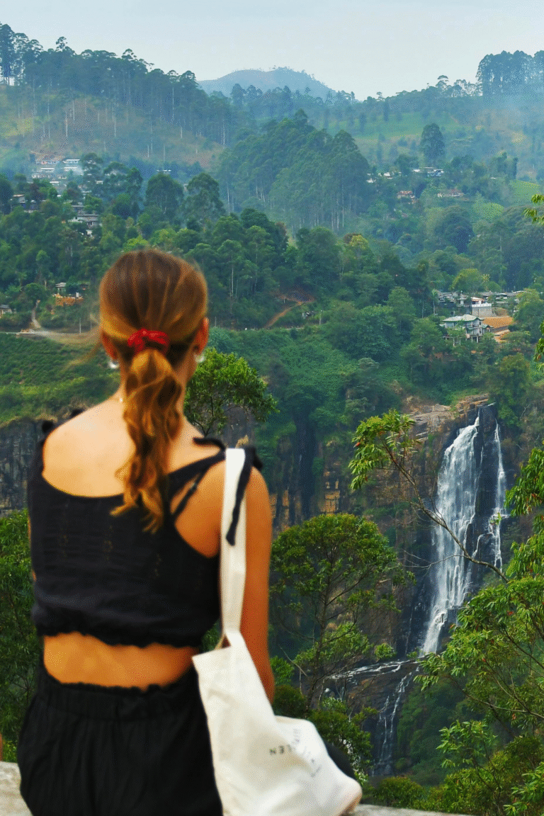 tourists enjoying Devon Falls waterfall in Sri Lanka