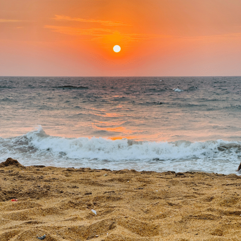 Golden sands of Mount Lavinia Beach on a sunny afternoon