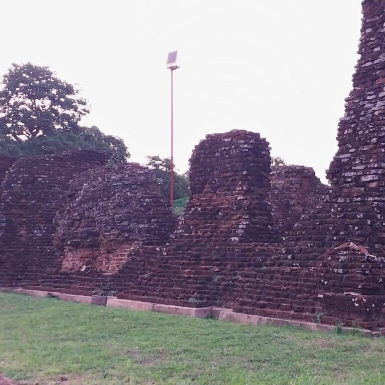 Old brick structure of Jethawana Image House under blue sky
