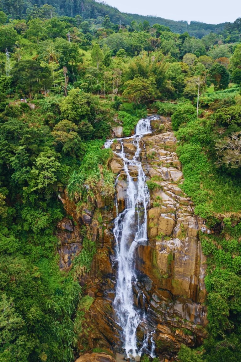 Kithal Ella waterfall flowing through lush green hills
