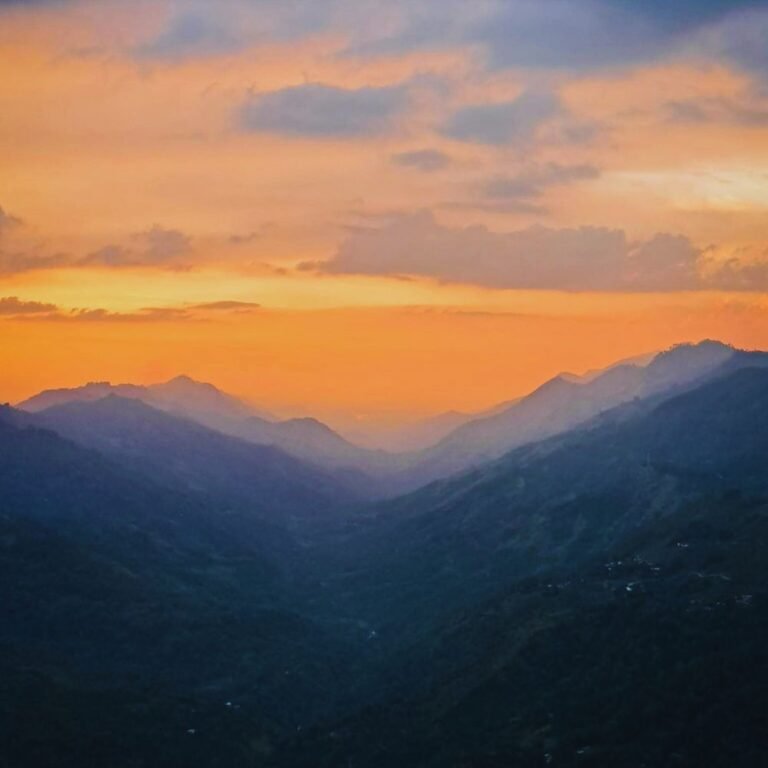 Sunrise over Lunugala Mountain with misty hills