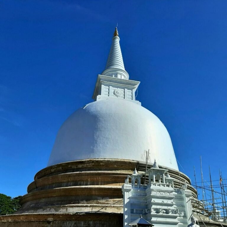The main stupa of Mahiyangana Raja Maha Viharaya surrounded by green landscape