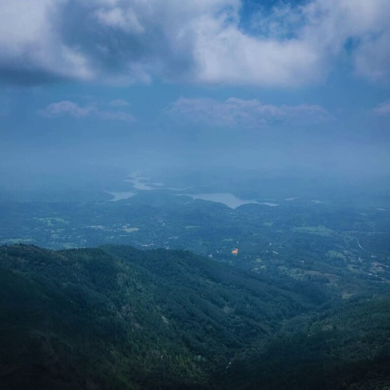 Calm water and green hills around Samanalawewa Reservoir
